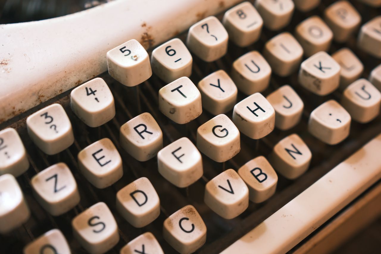 Close-up view of vintage typewriter keys, highlighting their retro charm and tactile texture.