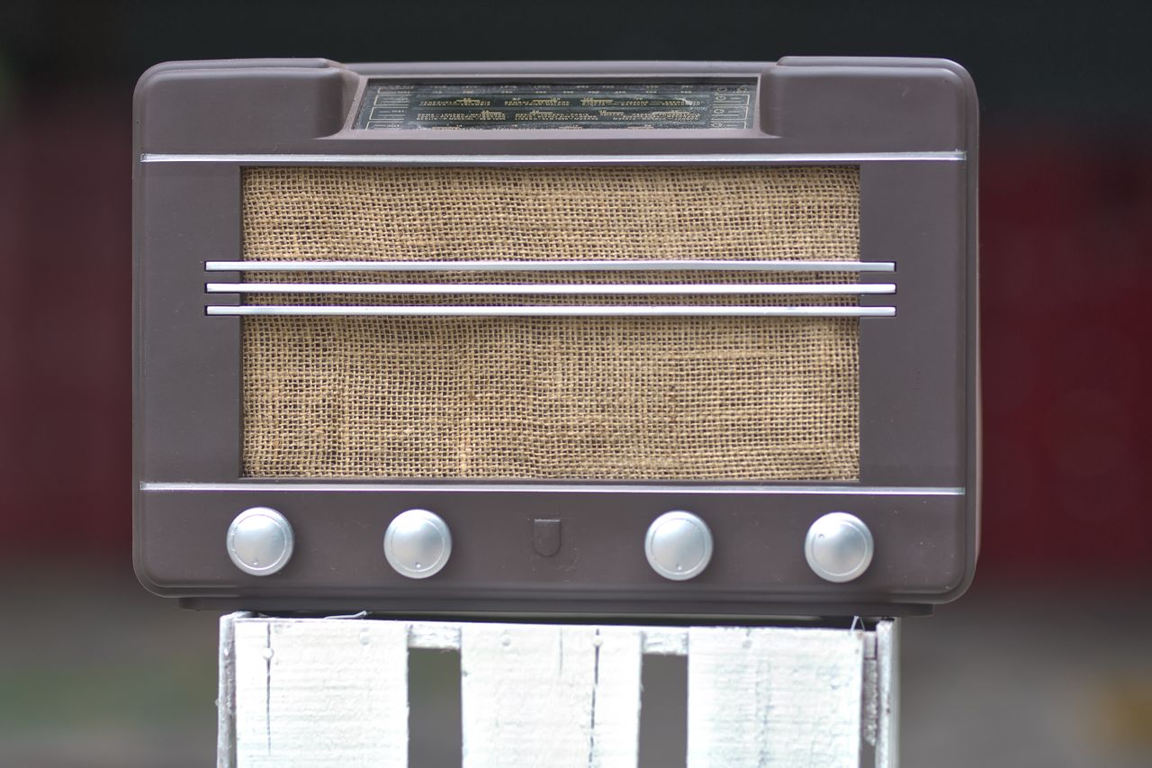Close-up of a vintage brown radio with a retro design and classic styling.